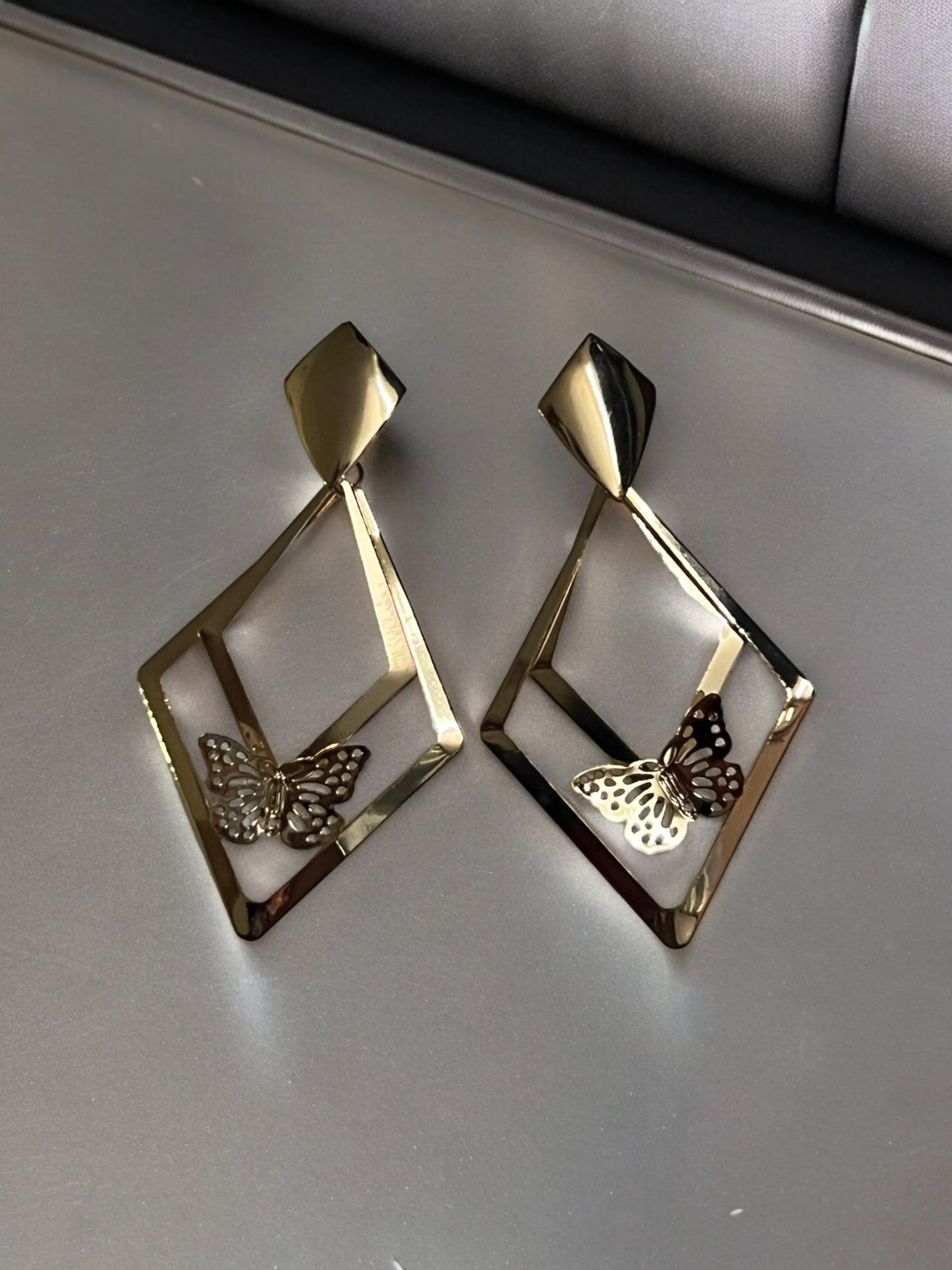 Ornafy Presents Golden Earrings with Triangle-Shaped Hanging and Butterfly Accent